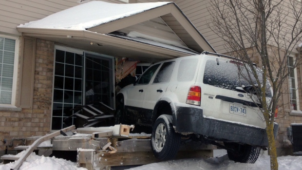 SUV into townhouse