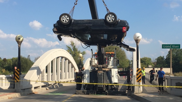 SUV hoisted from river