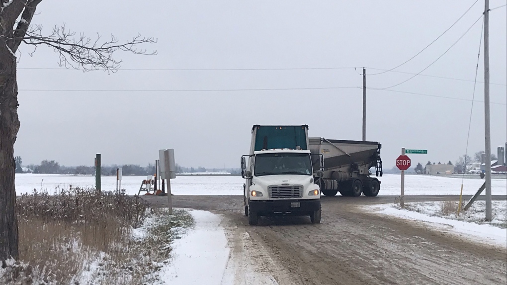 Trucks turn at a roadblock set up due to a crash in Woolwich Township (Chris Thomson / CTV Kitchener)