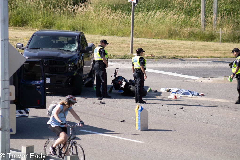 Police are pictured at the scene of a crash on Ira Needles Boulevard on June 28, 2022. (Submitted/Trevor Eady)