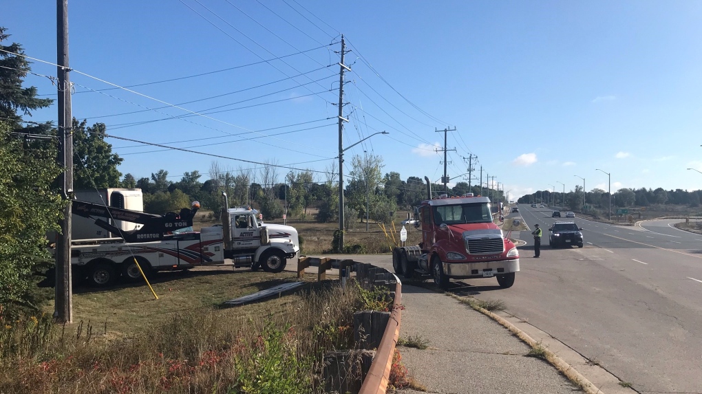 Police and tow trucks at the scene of a single-vehicle crash near Highway 85 and University Avenue in Waterloo. (Chris Thomson/CTV Kitchener)