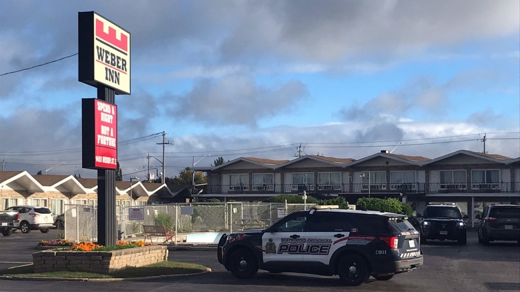 Police cars are seen parked in front of the Weber Inn in Kitchener around 9 a.m. on Thursday Sept. 22, 2022, shortly after police say a shooting occurred in the area. (Chris Thomson/CTV Kitchener)