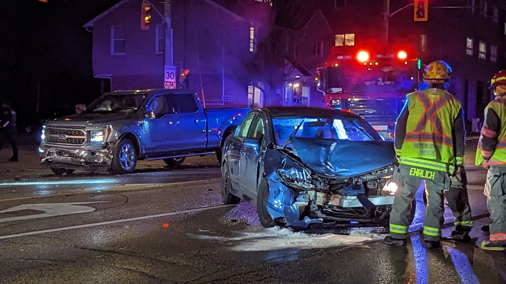 A pickup truck and a car, both with damage, at the scene of the crash. (Dan Lauckner/CTV News)