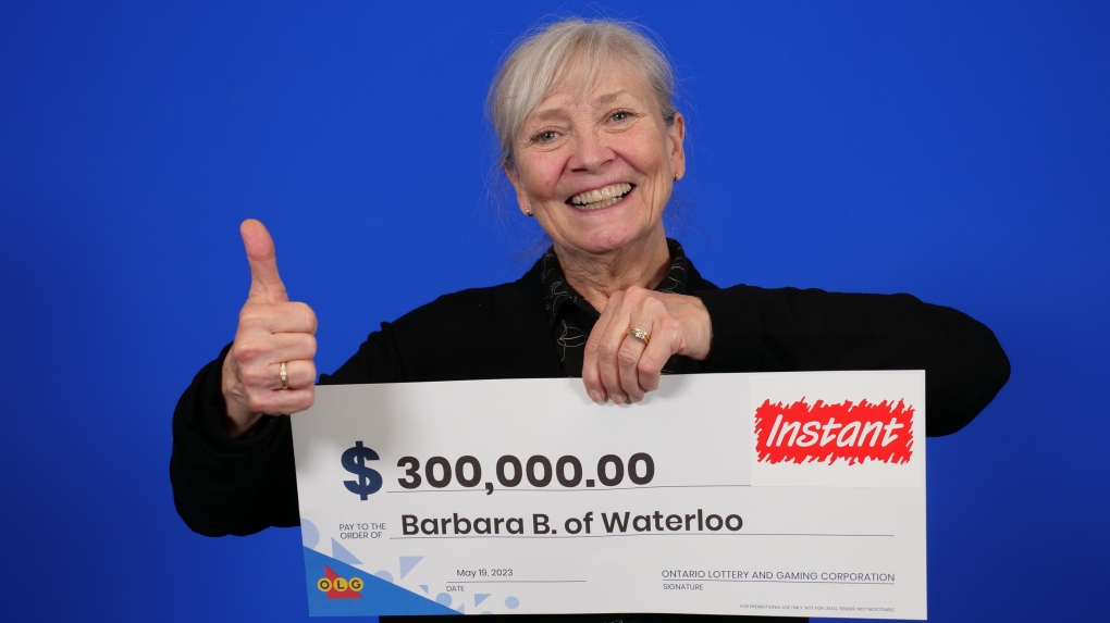 Barbara Beacock picks up her winnings at the OLG prize centre in Toronto. (Submitted/OLG)