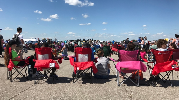 A family watches the airshow