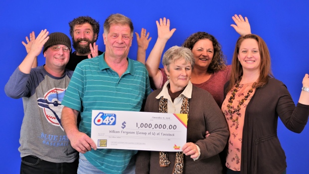 A group of six celebrating an OLG lottery win