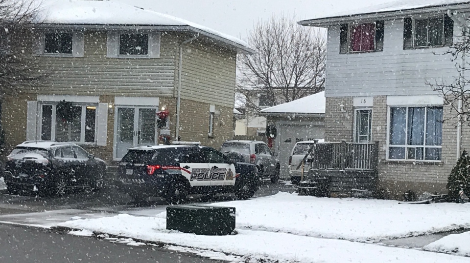 Police cruiser in driveway of a Cambridge home